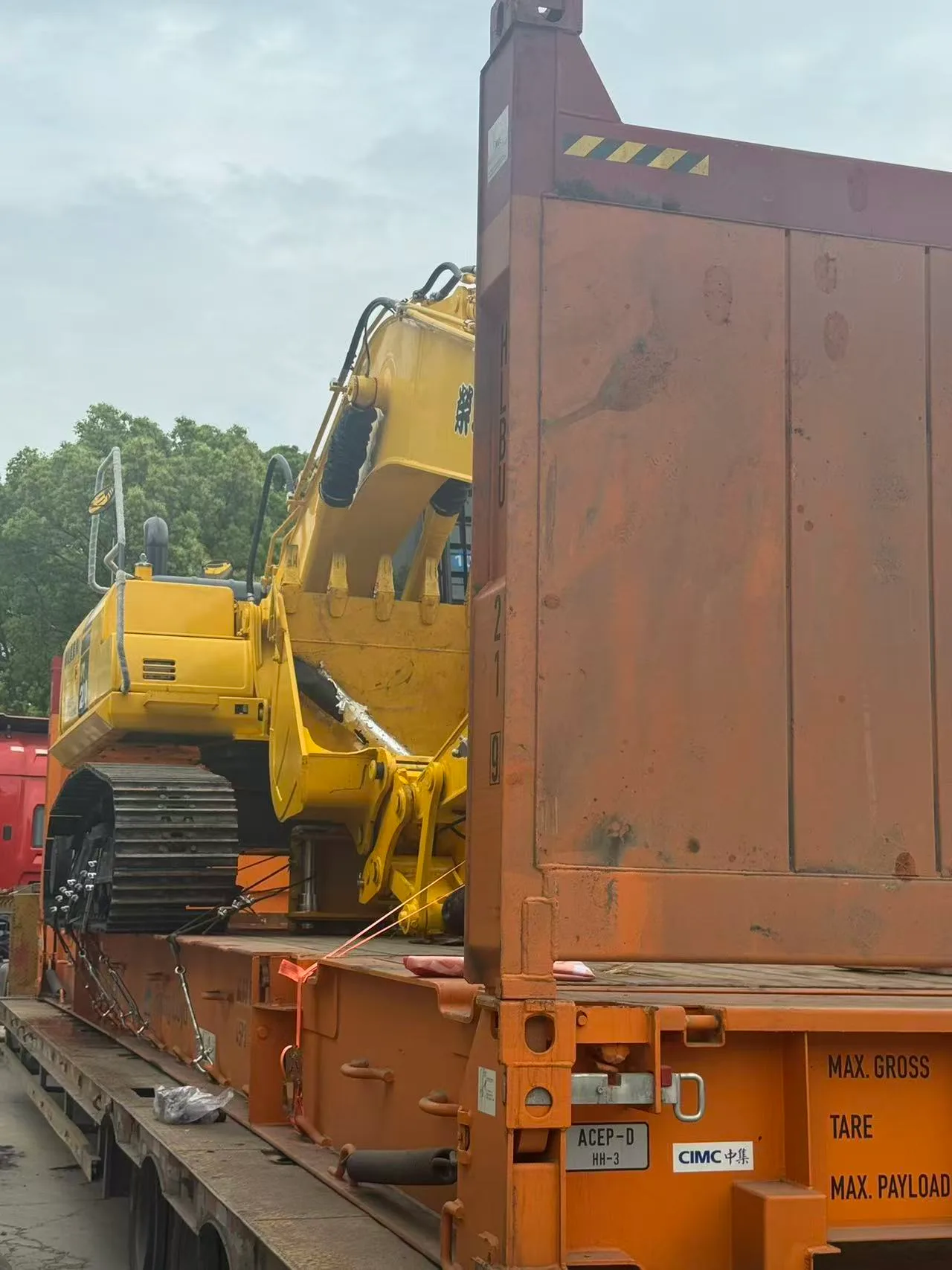 Komatsu excavator secured on a flat rack container for sea freight